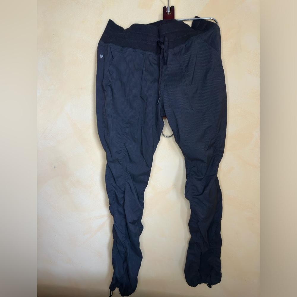 SHABHALA mid-rise ruched track pants with ankle drawstrings in black, size S.